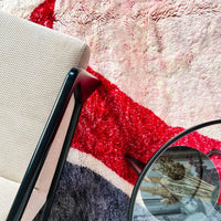Bring the beauty of the Moroccan mountains into your home with the Rosy Abstract Handwoven 100% Wool Beni Mrirt Rug, a classic Beni Ourain rug measuring 8.1 X 9.9 ft / 247 X 304 cm. Crafted using premium wool, this rug features a unique abstract design and luxurious texture.